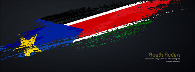 Grunge brush of South Sudan flag on shiny black background. Artistic glitter sparkle brush paint vector illustration