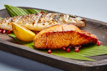 Fish served on wooden rustic plate