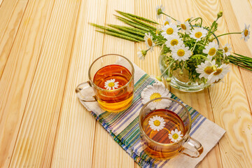 Chamomile tea. Fresh flowers, summer hot drink concept. Alternative medicine, lifestyle