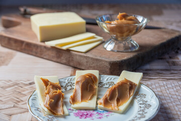 Sliced ​​cheese with milk sweet. With selective focus.