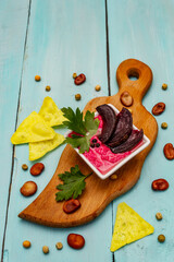Hummus, healthy vegan (vegetarian) food. Edamame dry beans, fresh leaves, spices, baked beetroot