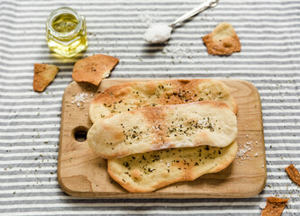 Thin italian flatbread with spices.Thin tortillas.Traditional italian focaccia with olive oil and salt.