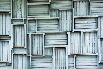 a wall of gray wooden boxes, a concept design and decoration of country houses in the loft style