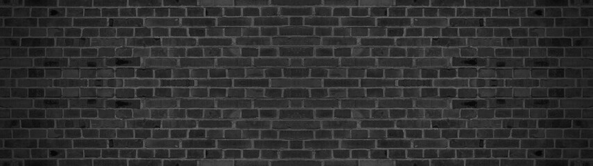 Fototapeta na wymiar Dark black painted brick stone masonry wall texture background wallpaper panorama banner