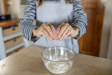 Woman cracking egg