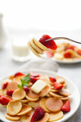 Mini pancakes on a fork