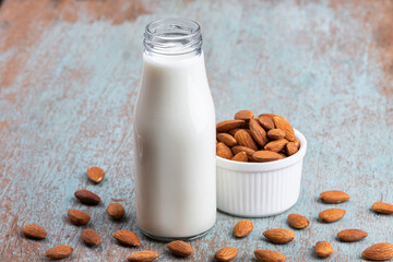 Almond milk with Almond seeds. Almond milk in a bottle with almonds