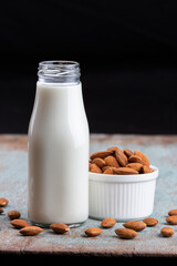 Almond milk with Almond seeds. Almond milk in a bottle with almonds