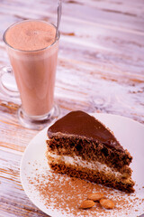 chocolate cake with chocolate milk on a wooden table
piece of delicious chocolate cake 