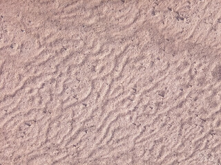 Dry ground texture with exotic wave characteristics caused by wind blowing in the top view