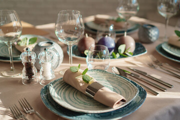 Luxury green table setting decorated with candles