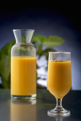 mango smoothie in clear glasses to drink