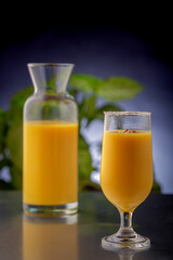 mango smoothie in clear glasses to drink