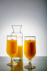 mango smoothie in clear glasses to drink
