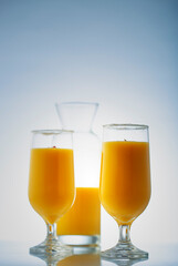 mango smoothie in clear glasses to drink