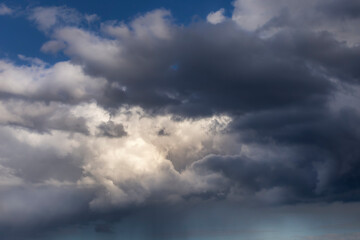 Obraz premium cloudscape with moody and fluffy clouds