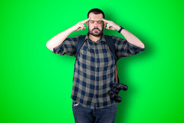 Caucasian handsome traveler man isolated on chroma background thinking an idea while looking up