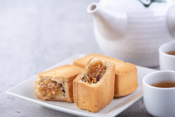Pineapple cake pastry - Taiwanese famous sweet delicious dessert food with tea, close up, copy space design.