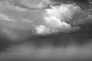 rain clouds hanging over the sea