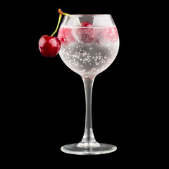 Cherry in a wineglass isolated on white background with clipping path