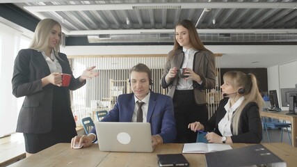 Workers meeting at lunchtime. People Working On Computer In Modern Office