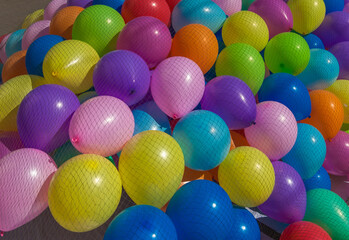 Many colored balloons under the net