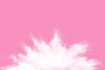 White powder explosion isolated pink background.