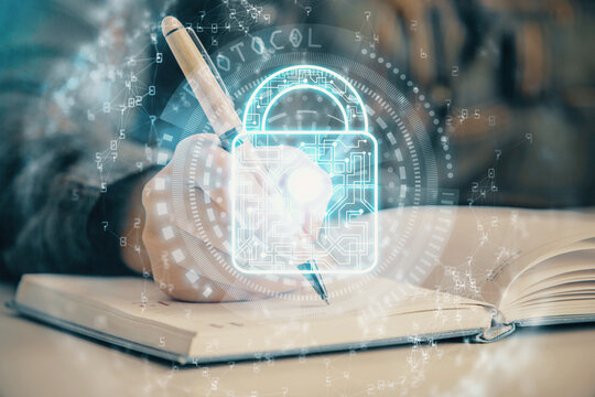 Double exposure of hands making notes with lock icons. Concept security and protection of data
