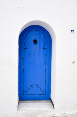 Fototapeta premium Traditional old painted door in Sidi Bou Said, Tunisia.