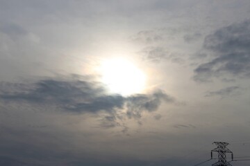 The evening sky was gray over the electric tower