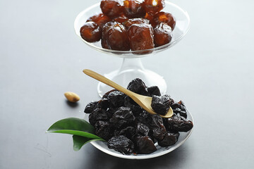 Healthy foods. Dried fruits for diet. Prunes, dates, raisins and figs. Healthy and proper nutrition for life.