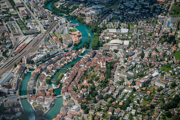 aerial view of the city center of Thun with Schloss Thun, Aare and Bälliz  seen from the Helicopter © schame87