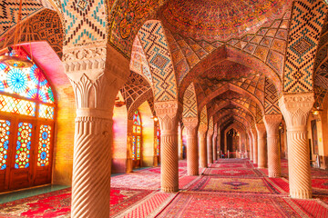Famous pink mosque decorated with mosaic tiles and religious calligraphic scripts from Persian...
