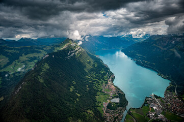 aerial view of Lake Brienz with Harder, Interlaken, Bönigen, Ringgenberg and Augustmatthorn in the Bernese Alps seen from a helicopter