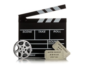 Single, black, open movie clapper or clapper-board with film reel and movie theatre tickets on white