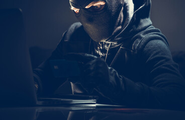 Masked Hacker and Stolen Credit Card Online Purchases