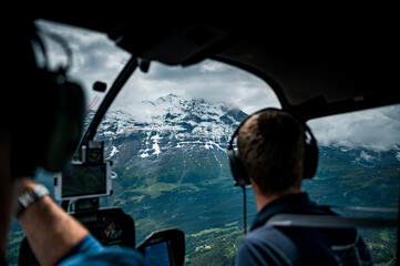 aerial view of a Eiger Nordwand in the Bernese Alps with a helicopter pilot