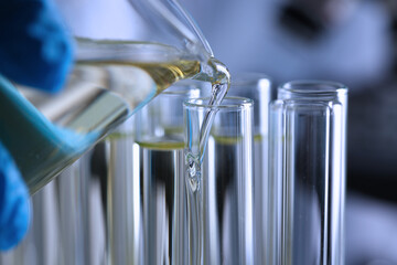 Close up of scientist in sterile gloves doing laboratory test in clinic