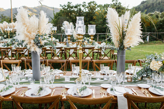 Wedding Table Set Up In Boho Style With Pampas Grass And Greenery