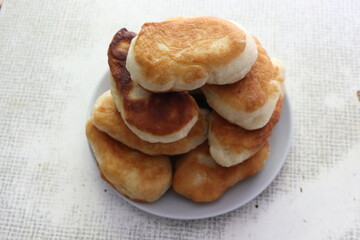 
Yeast cakes baked in butter. They are rosy and tasty. Golden crust crunches when eating