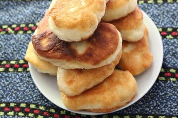 
Yeast cakes baked in butter. They are rosy and tasty. Golden crust crunches when eating