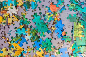 Not assembled colorful jigsaw puzzle. Board games for children and adults. Family and friendly pastime concept