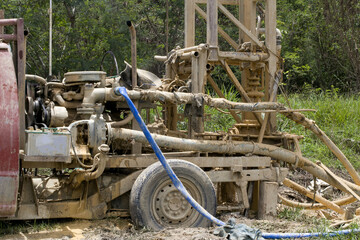 ground drilling water machine on the old truck drilling in the ground for water