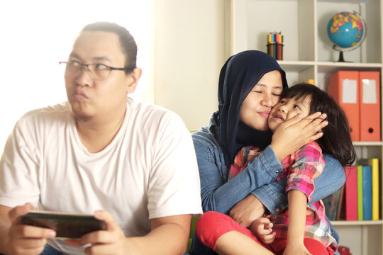 Asian father jealous of his own child, mom takes care of her daughter makes dad feels left alone