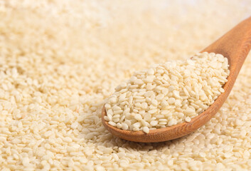  white sesame on wood spoon