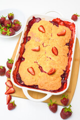 step by step recipe strawberry cobbler homemade from ripe fresh strawberries and shortbread on a light background, top view