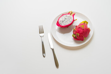 time to eat, raw fruit diet with fresh raw food ob the plate with knife and fork