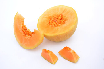 half of ripe muskmelon isolated on white background.