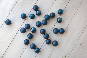 Ten blue christmas balls on a wooden background. New Year concept. 