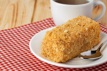 Piece of honey cake on kitchen table